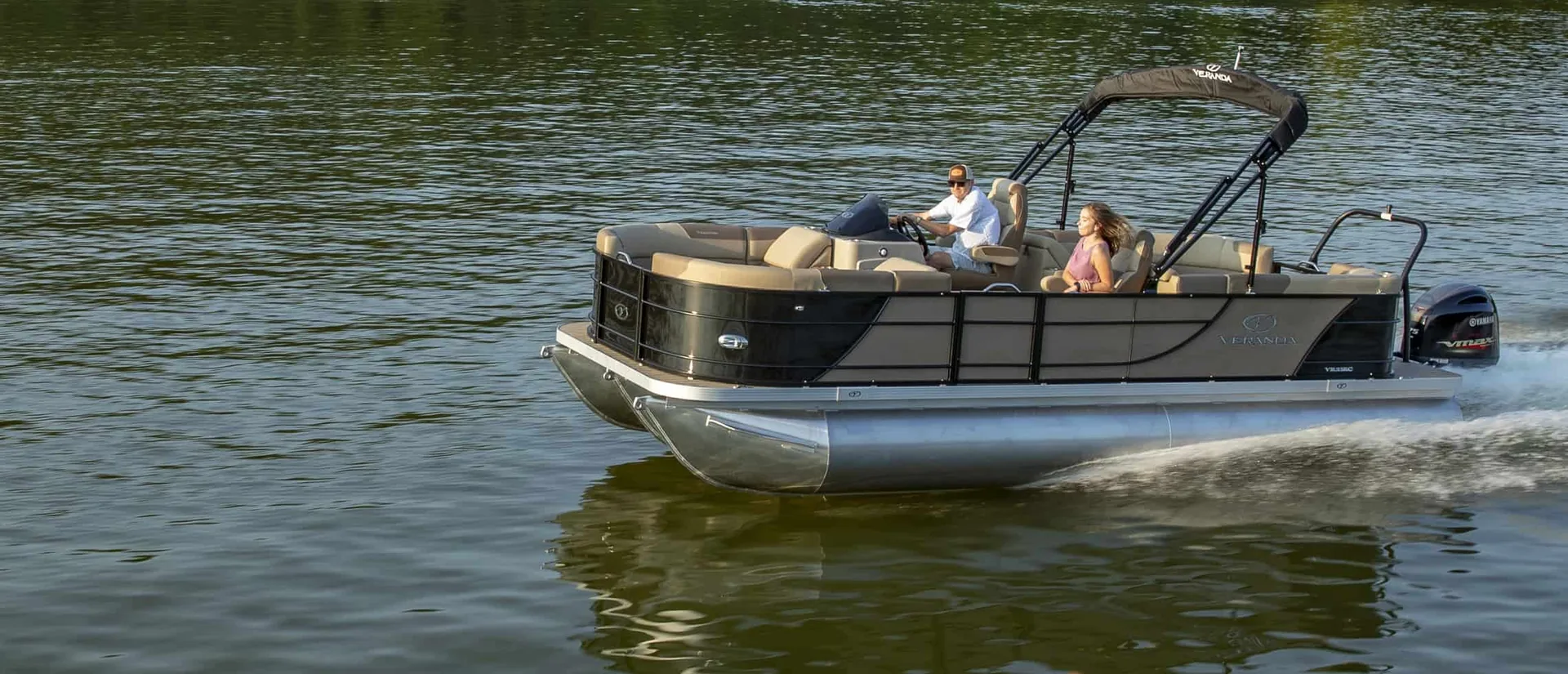 Veranda pontoon with a family aboard running on a Texas lake