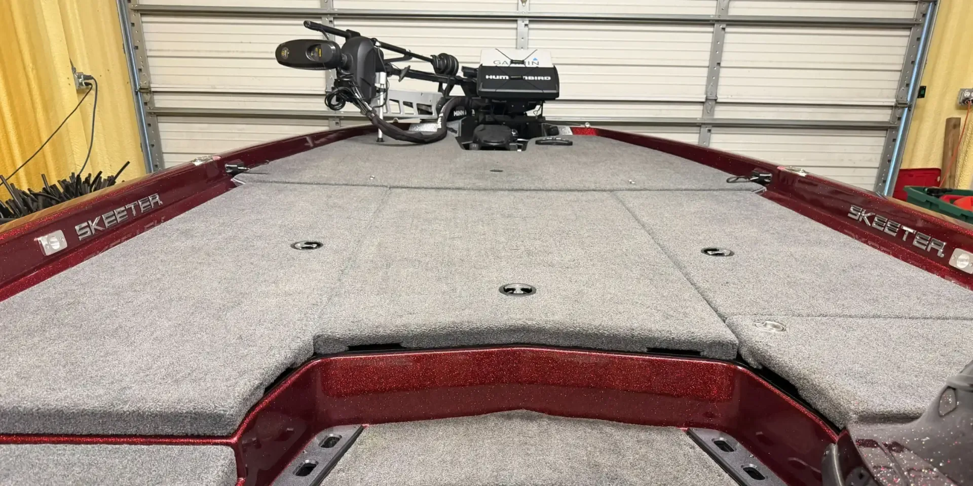 Bow of a Skeeter bass boat with a Minn Kota Ultrex trolling motor and Garmin and Humminbird graphs
