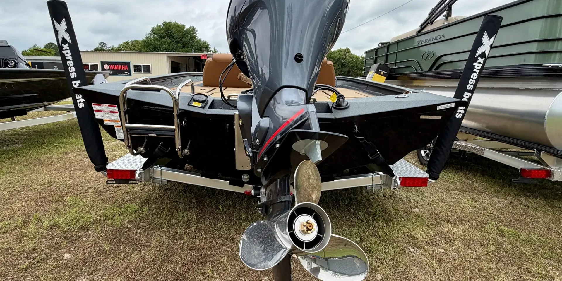 Lower unit and stainless propeller of an outboard on an Xpress bass boat at Sartin Marine