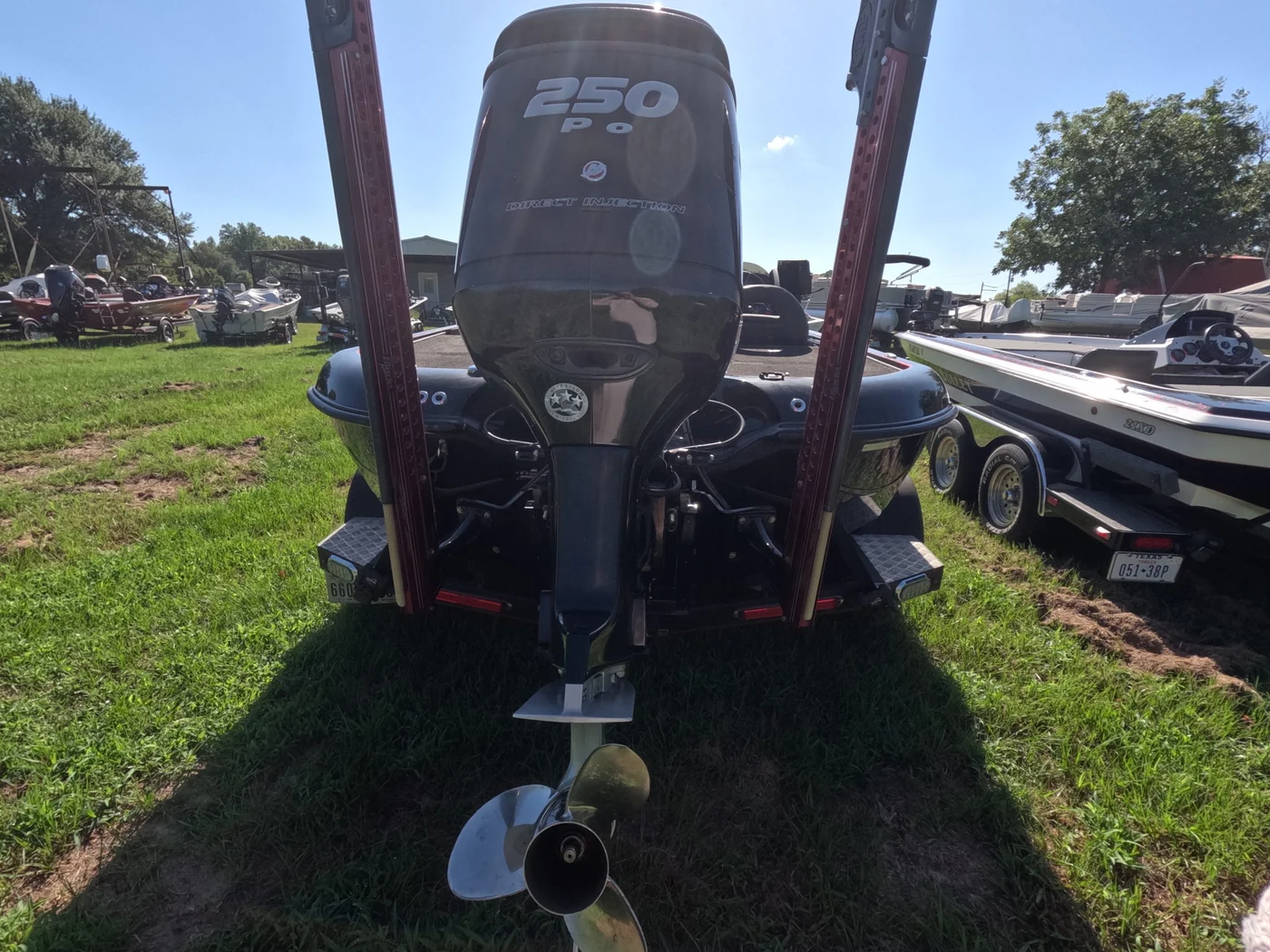 Rear view of a Mercury 250 Pro XS outboard with its propeller, on a bass boat at Sartin Marine